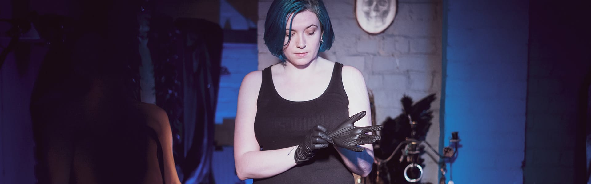 Sadistic London Dominatrix in latex gloves